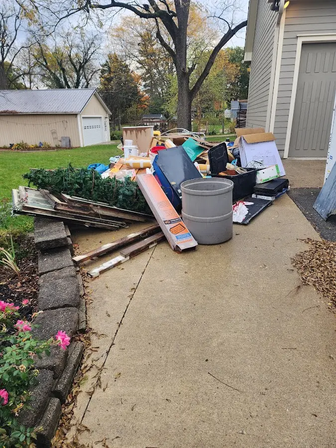 Dumpster being loaded with debris for Demolition Dumpster Rental in Justice